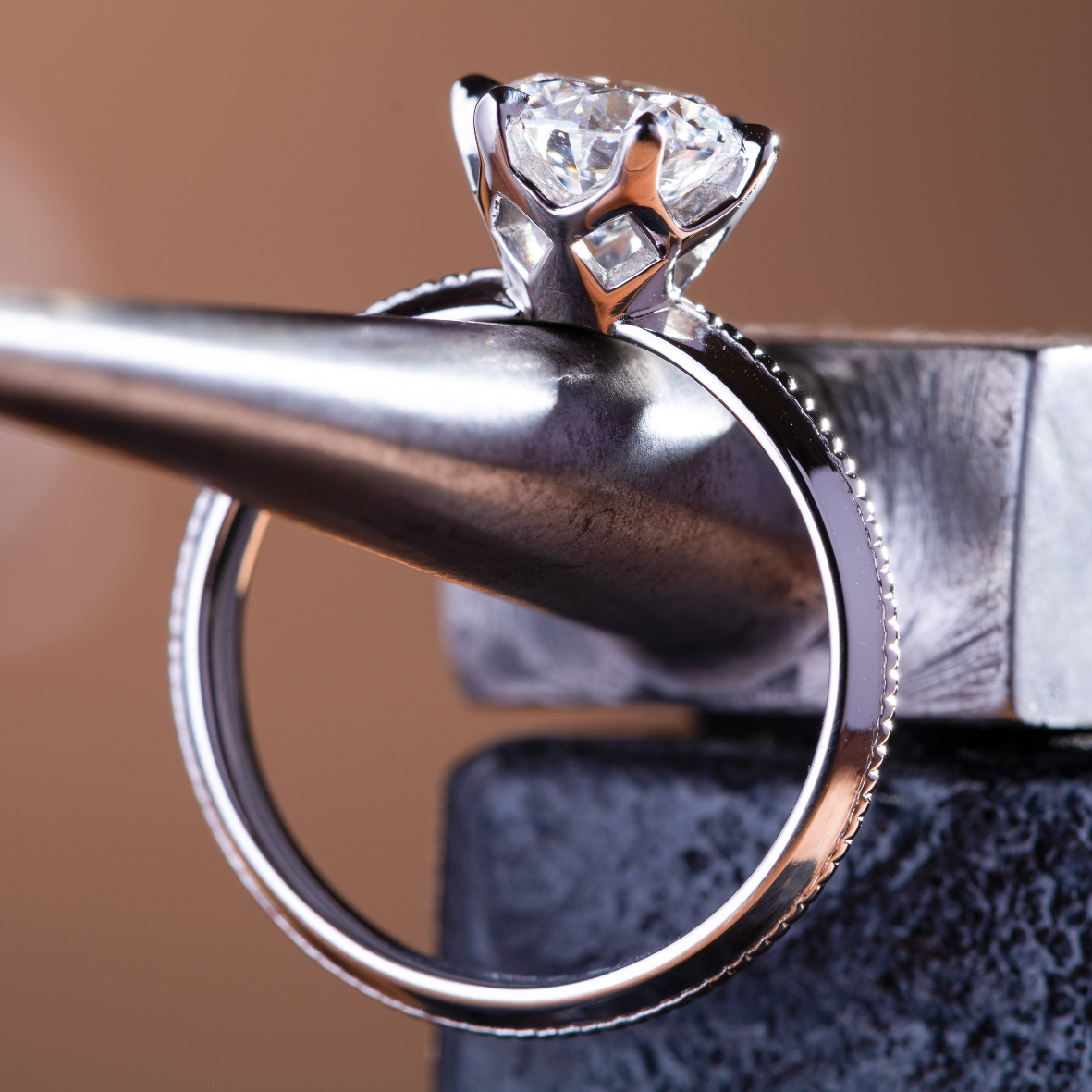 Close up of platinum ring with round brilliant cut diamond