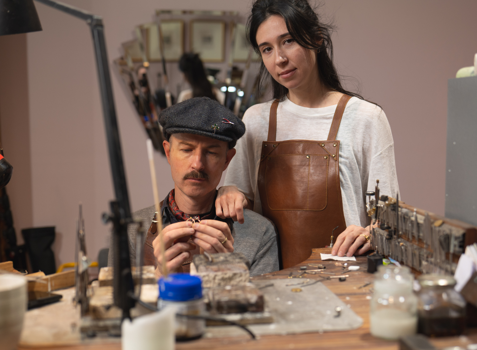 Terry Cockrem and Daria Fox in their workshop inspecting some rings.
