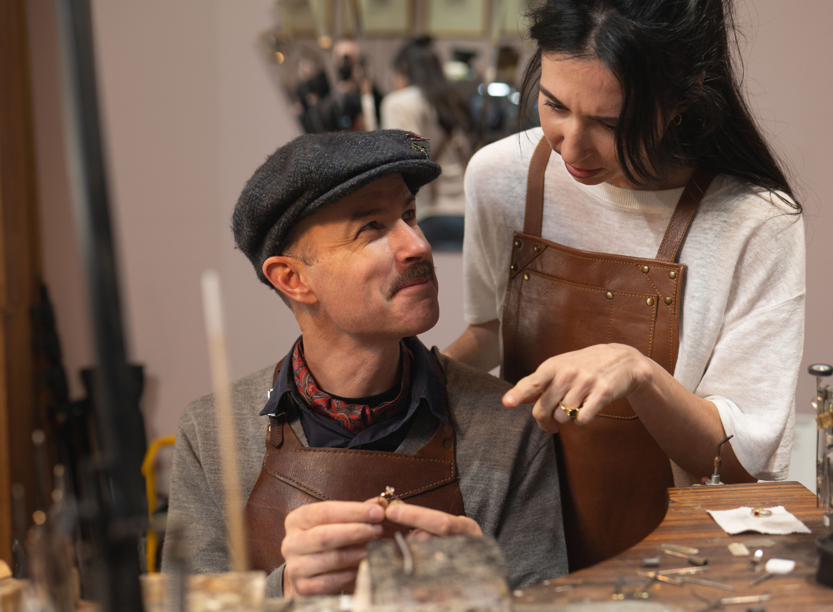 Jewellers inspecting freshly made custom rings in Olinda studio.
