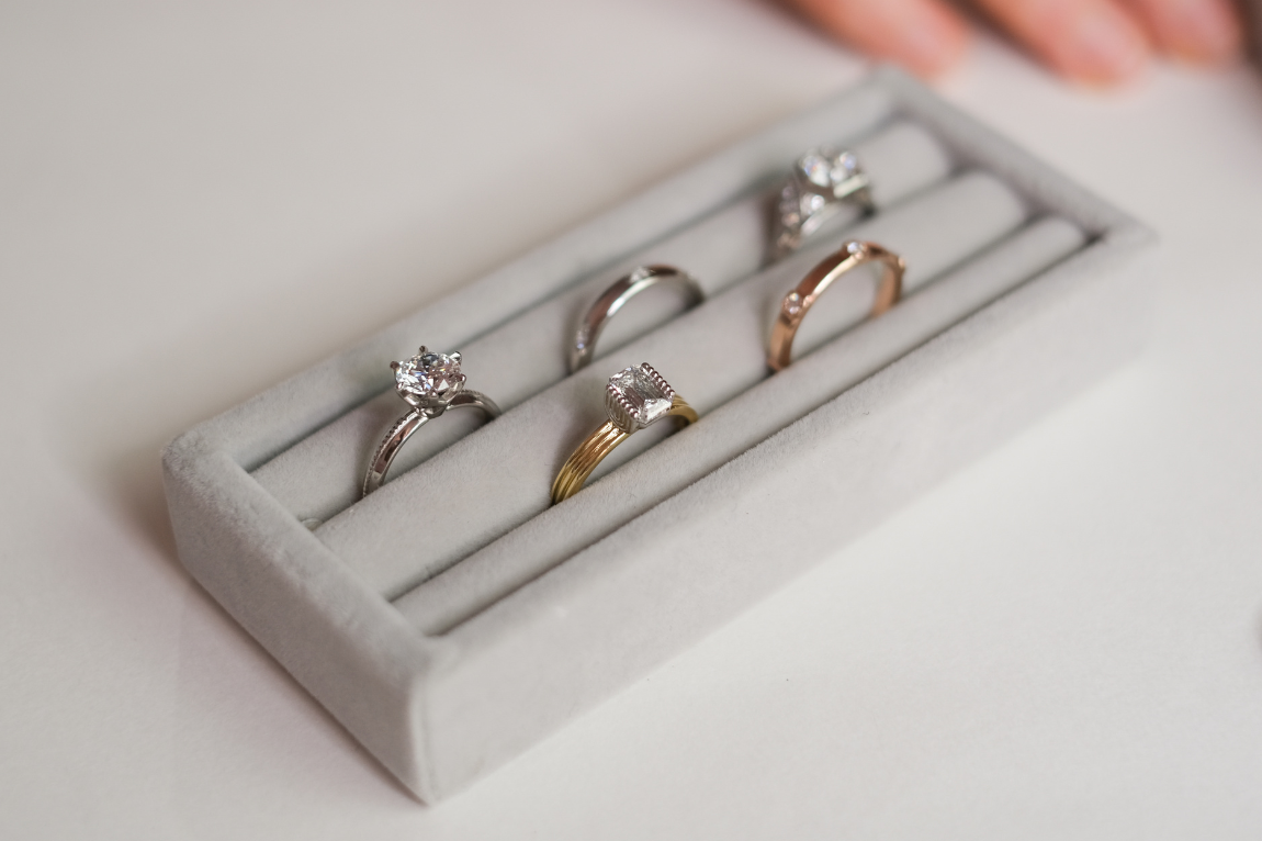 Set of rings in a grey jewelry box on a light background
