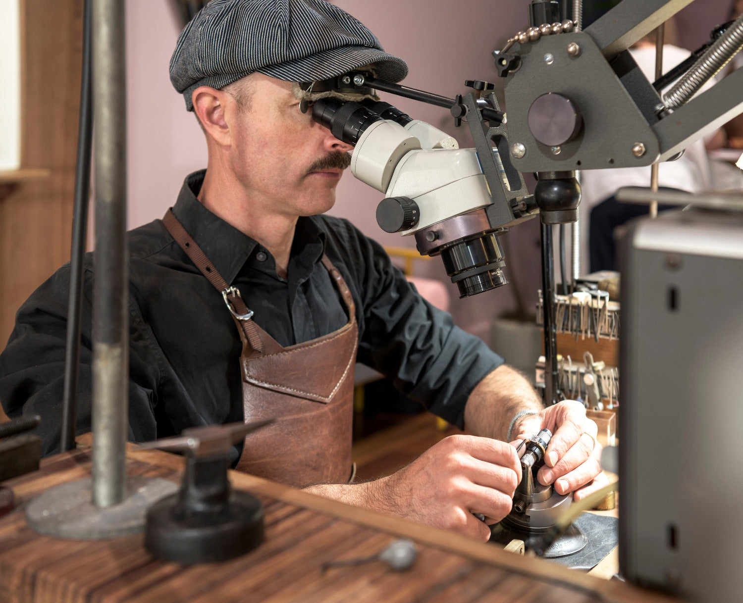Terry Cockrem looking through magnification whilst working on a ring