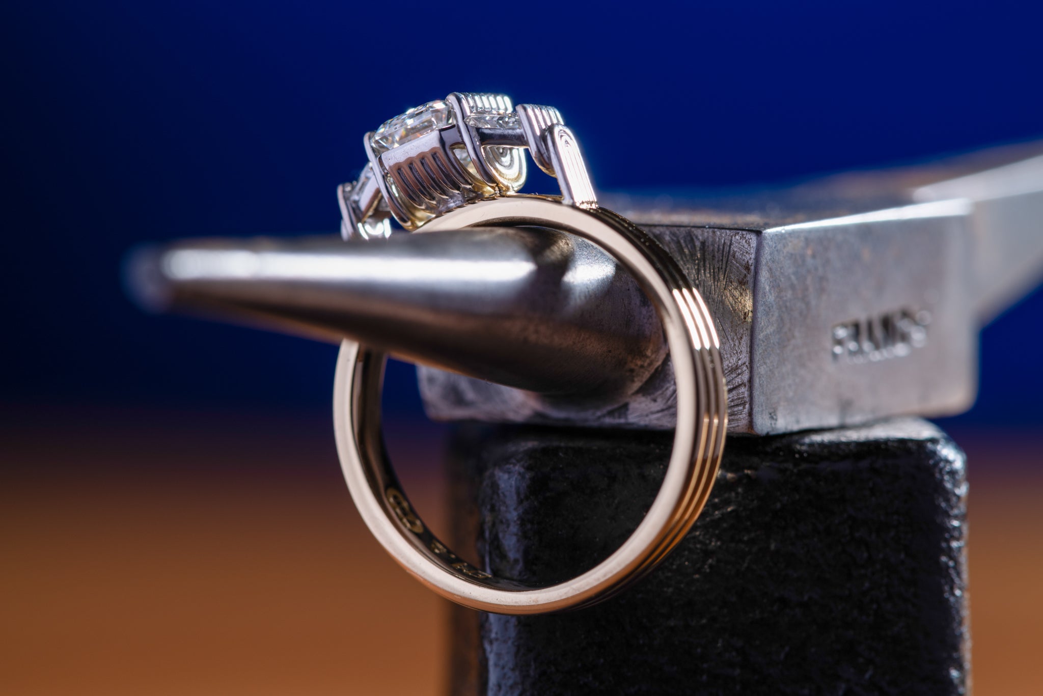 Close up of a gold ring with diamonds in a art deco style