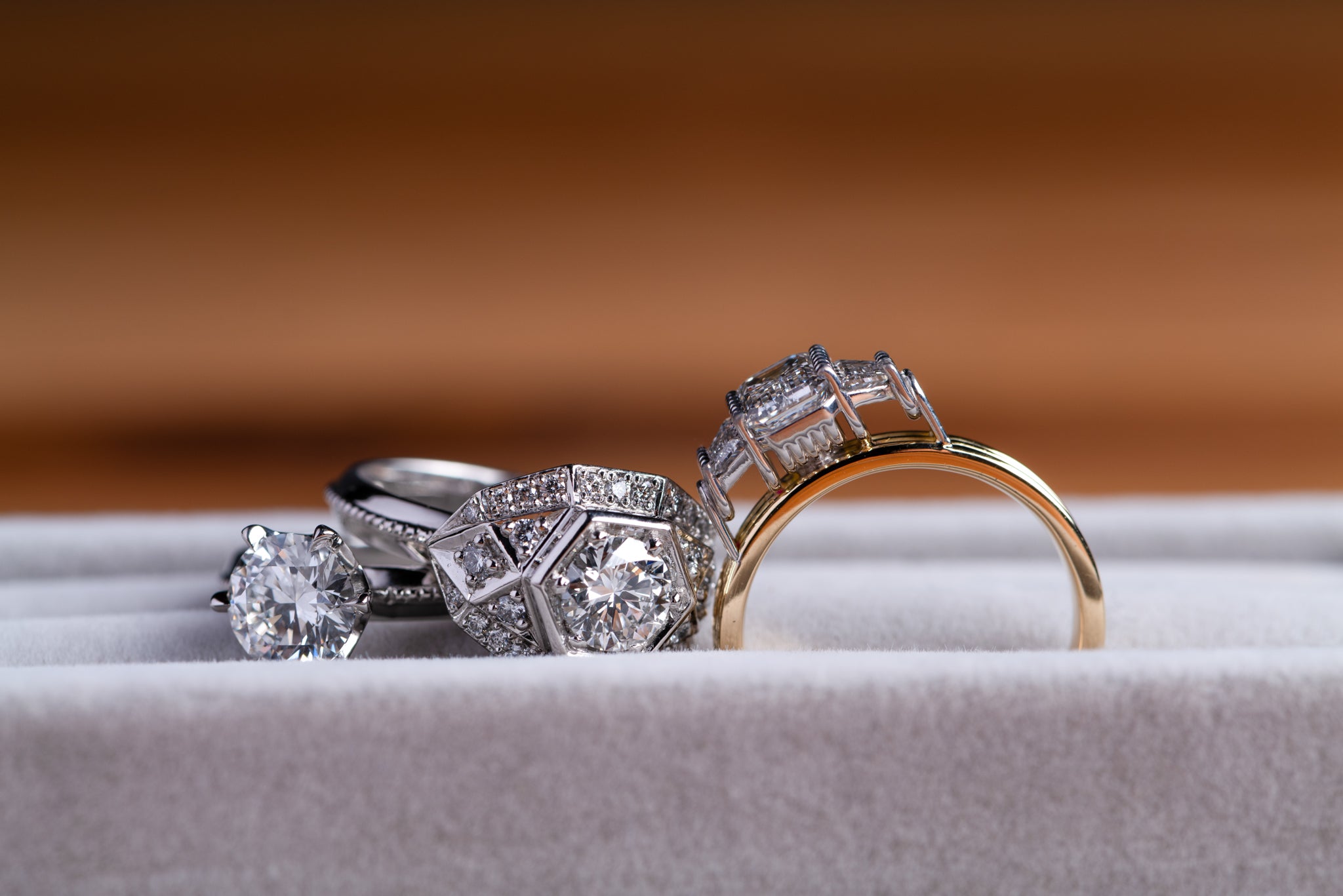 Close up of three different diamond engagement rings 
