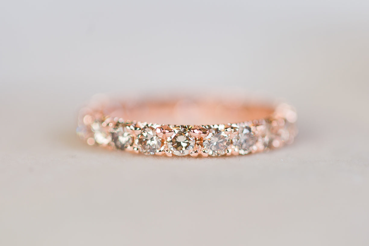 Custom rose gold ring with diamond throughout the band