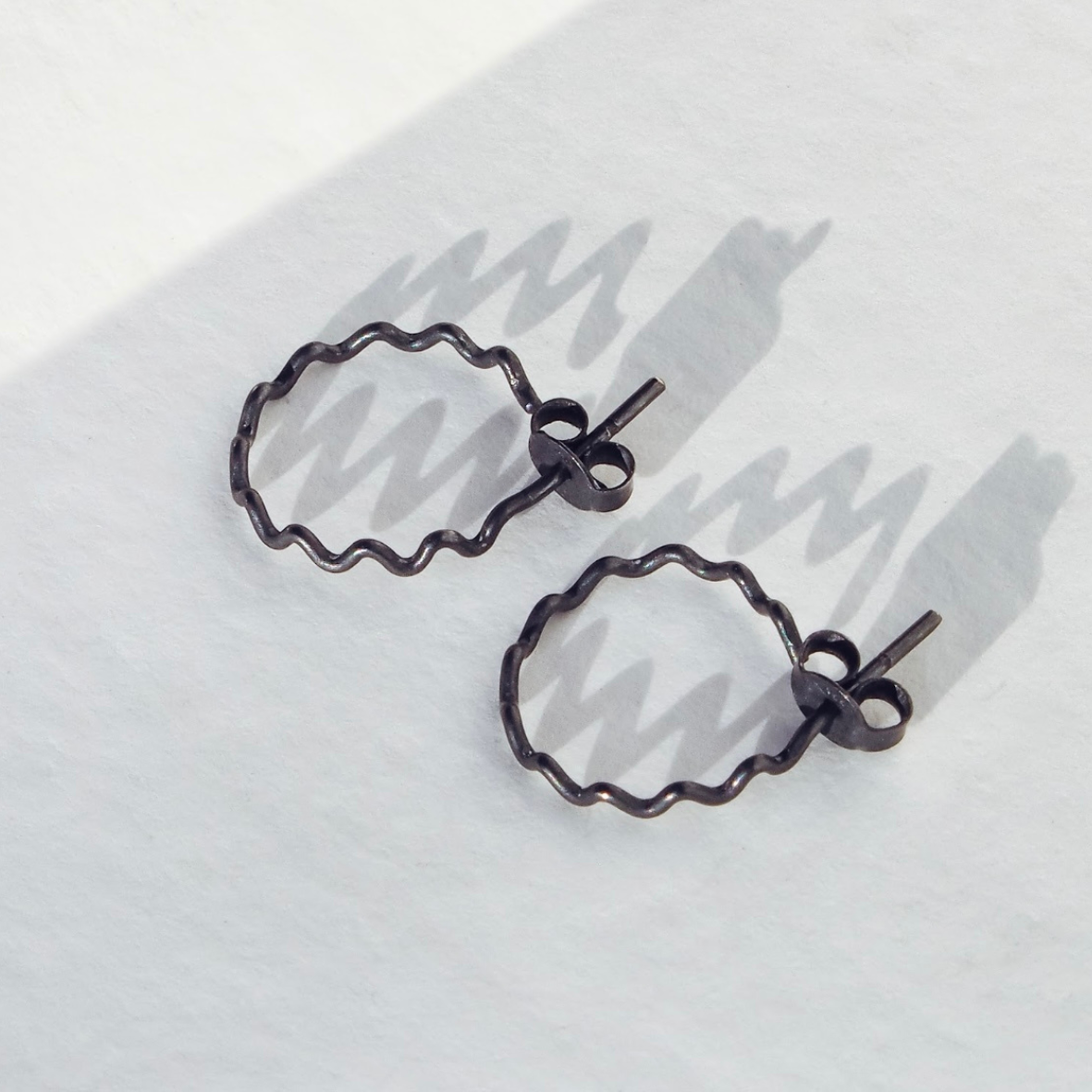 Small Crinkle Hoops in Oxidised Sterling Silver by Daria Fox