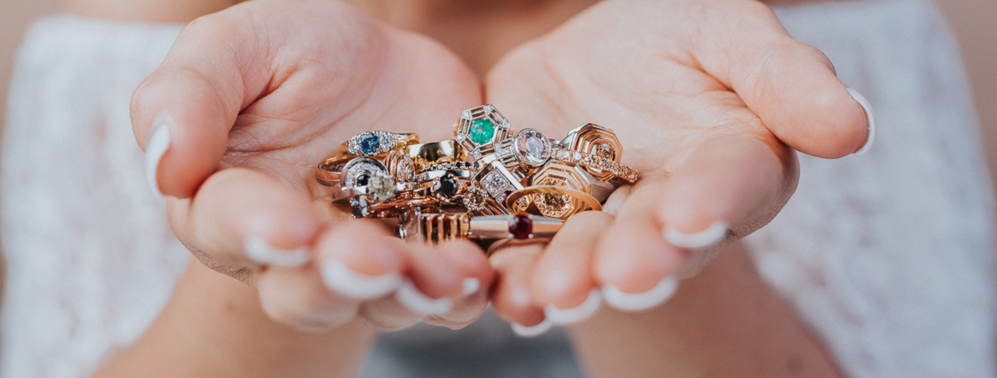 Lady holding a collection of rings in her hand