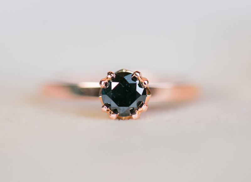 Rose gold ring with a black gemstone made by Terry Cockrem